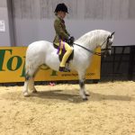 Charlotte Kilbey sitting on a horse