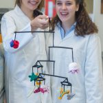 girls wearing lab coats