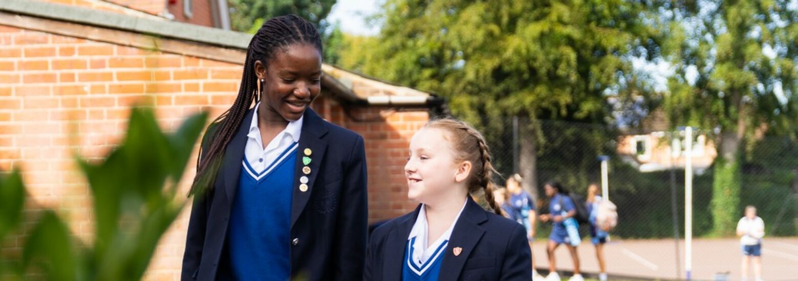Two St Marys Senior school girls walking in the grounds of the secondary school in Colchester Essex